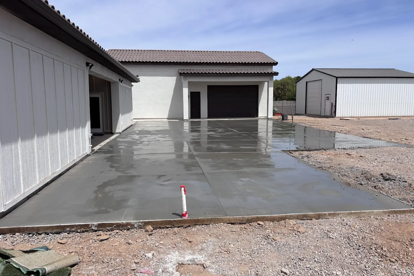 Freshly poured concrete driveway at a Queen Creek, Arizona home
